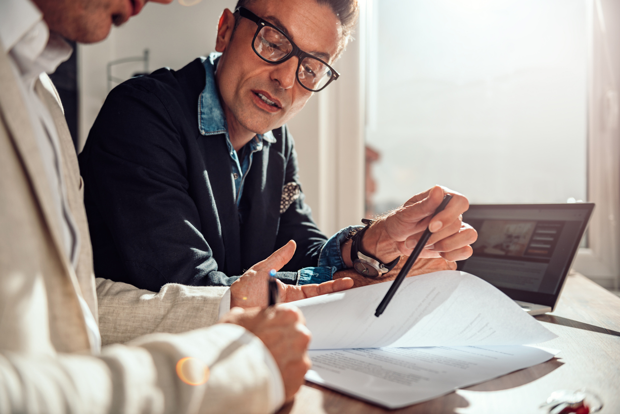 Insurer discussing insurance policies with a client