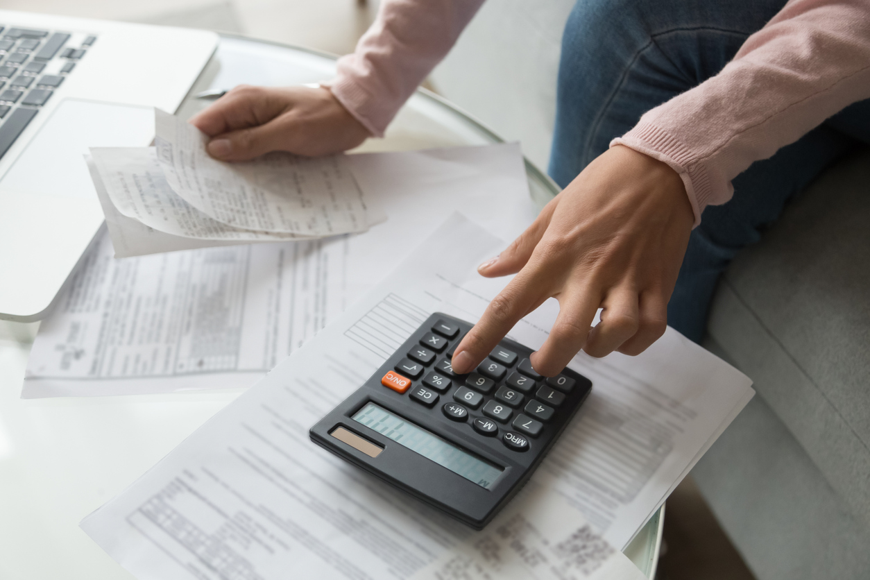 Woman calculating company debts