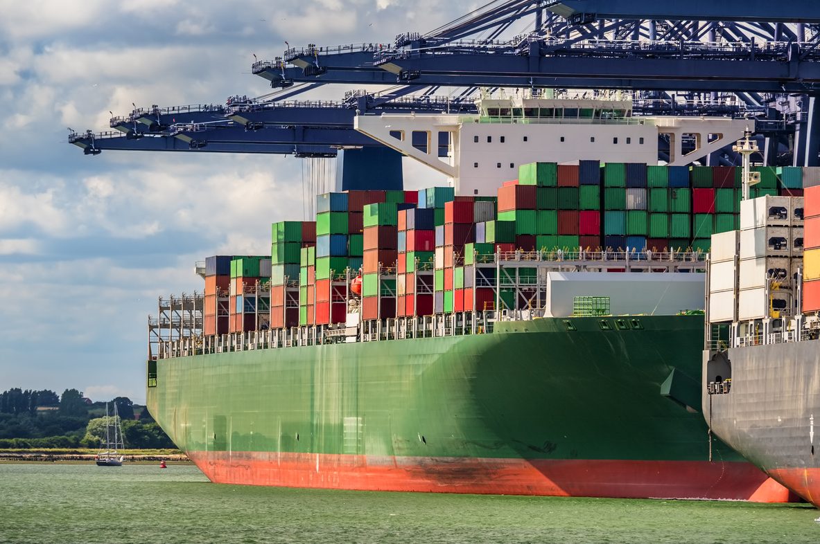 Green container ship in Felixstowe port