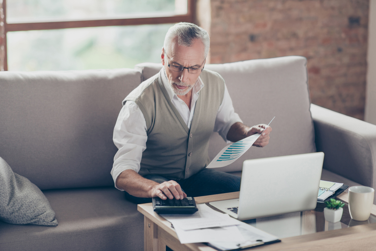 Older man checking his credit report