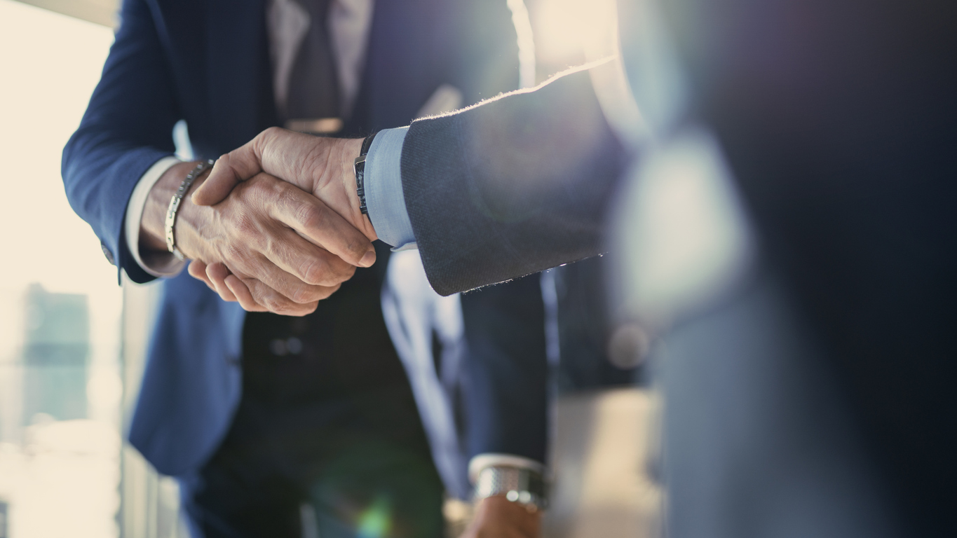 Business partners shaking hands after a meeting