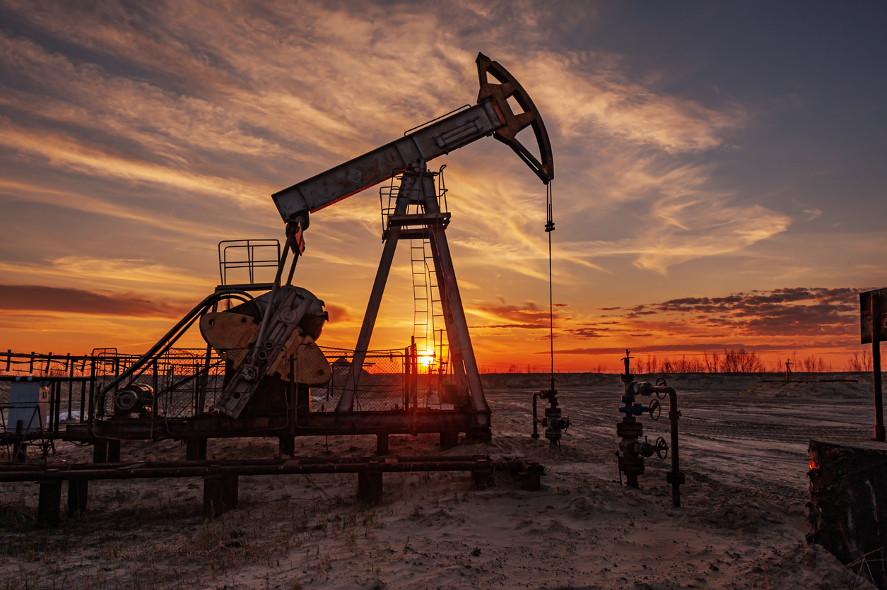 Oil derrick at sunset