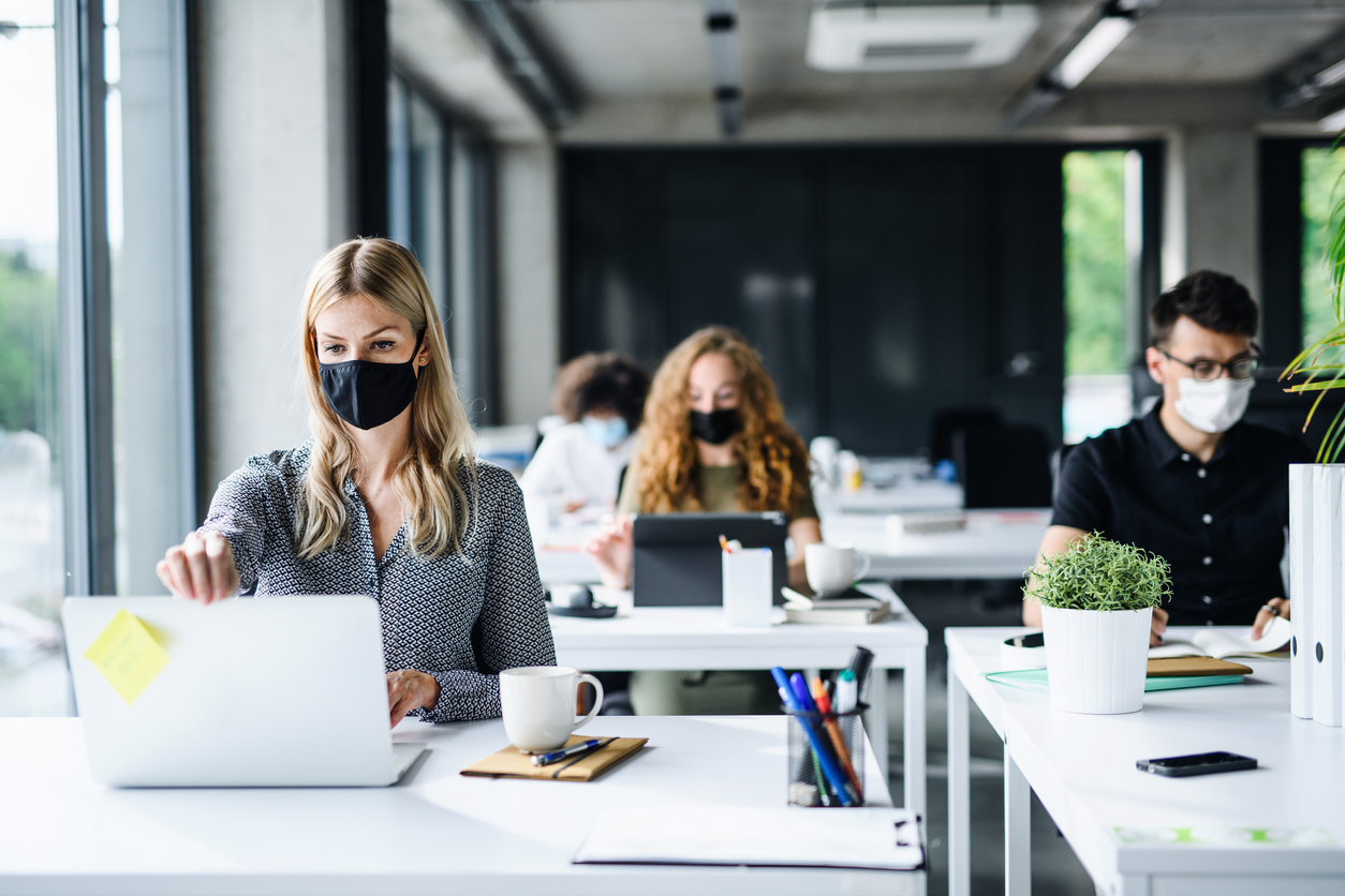 Young office workers wearing face masks