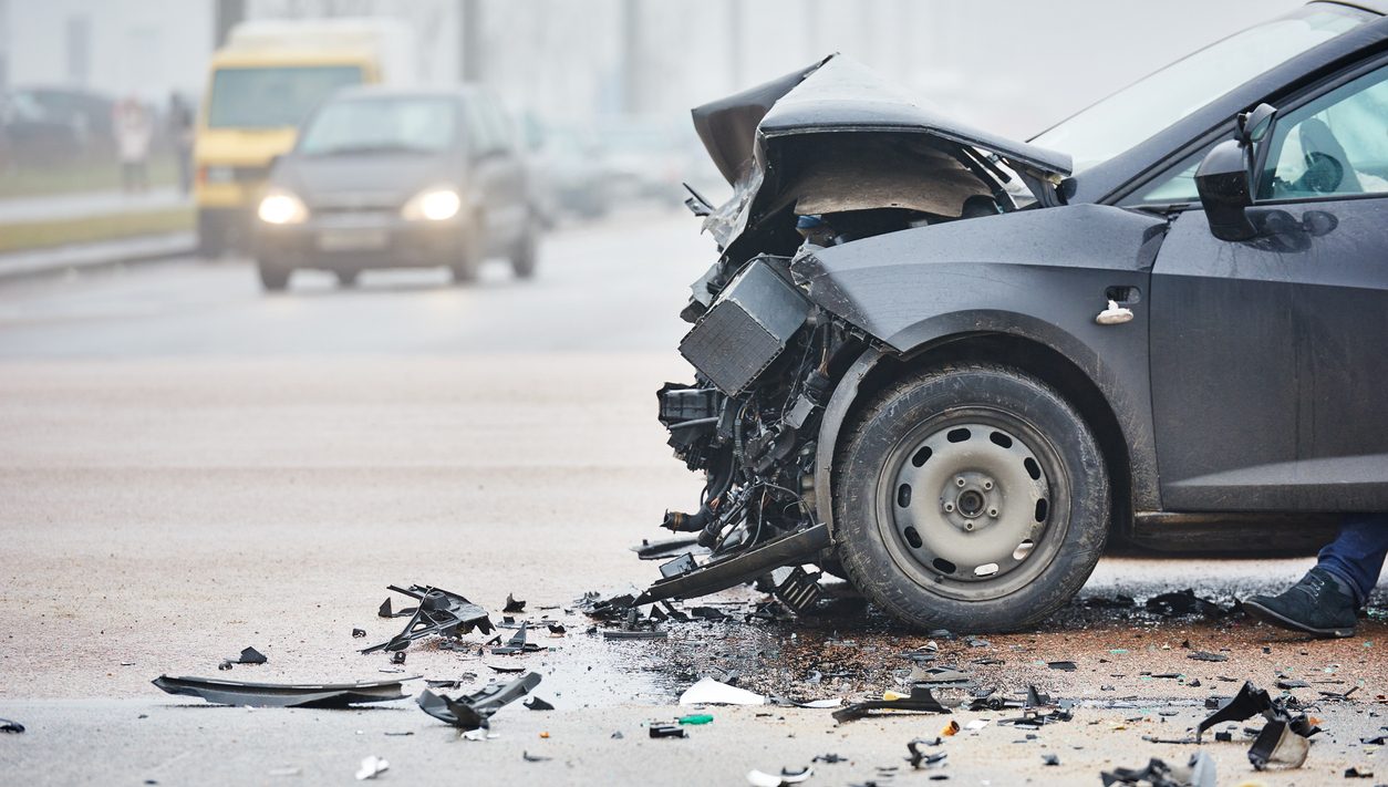 Damaged car in an urban street