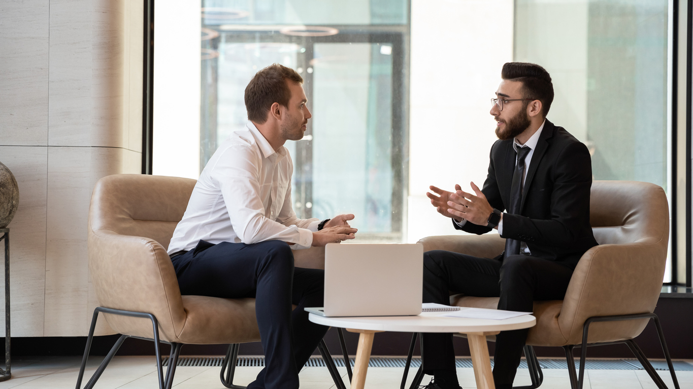 Independent financial adviser talking with client