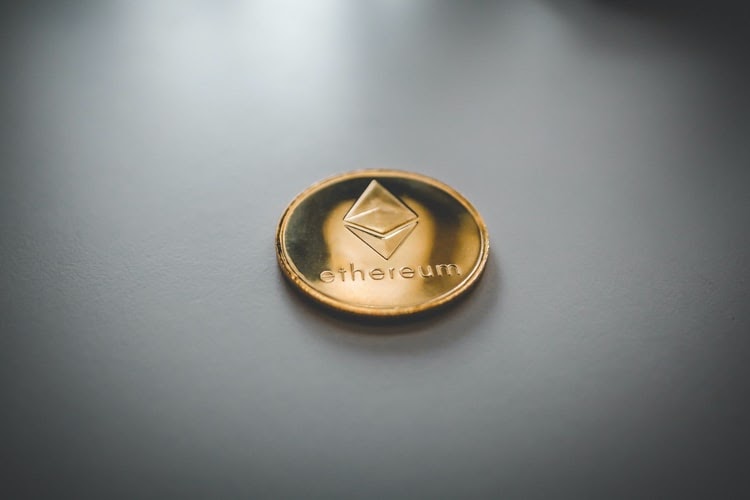 Ethereum token on a grey table