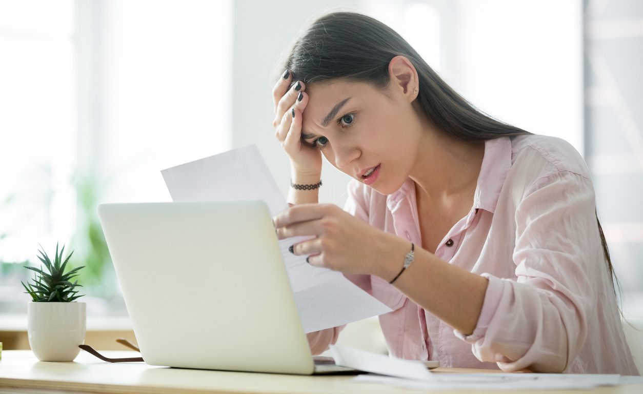 Woman reading a bad credit report