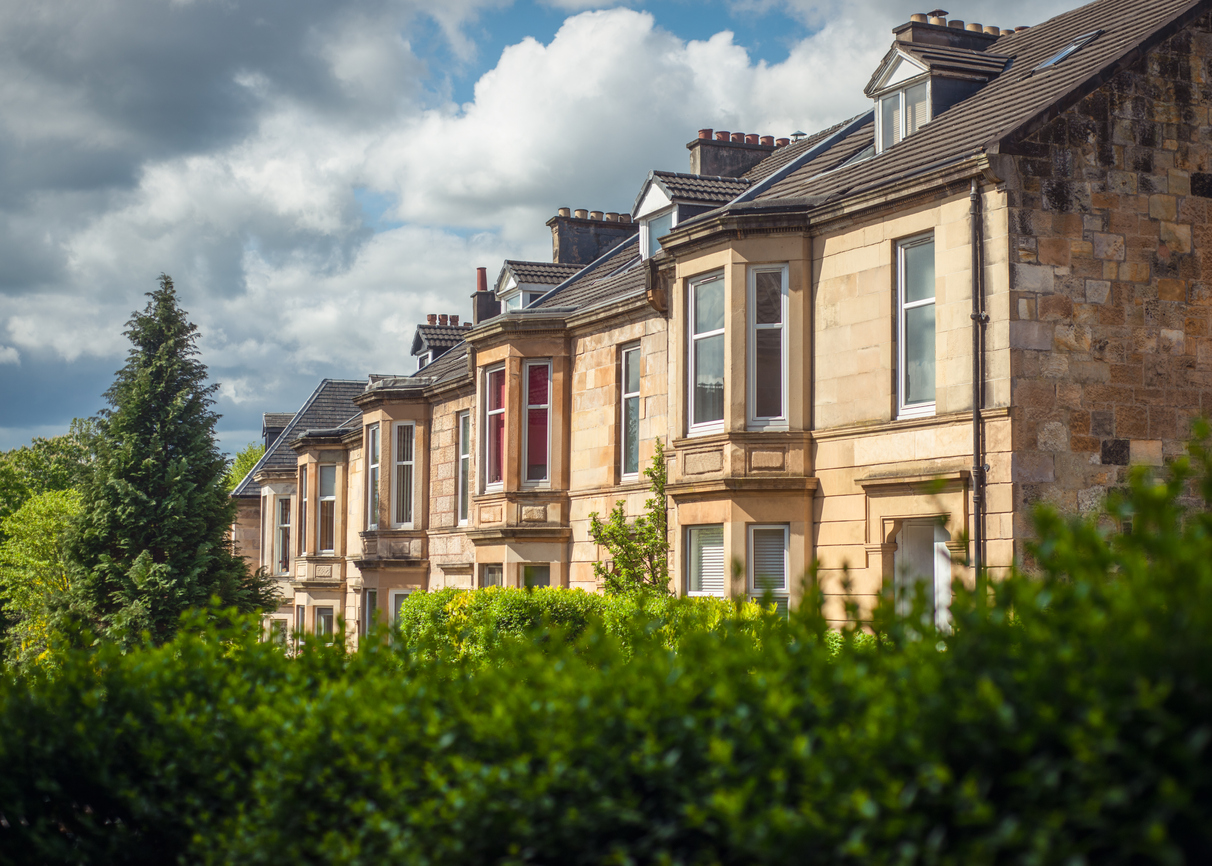 Sandstone terrace houses on leafy street