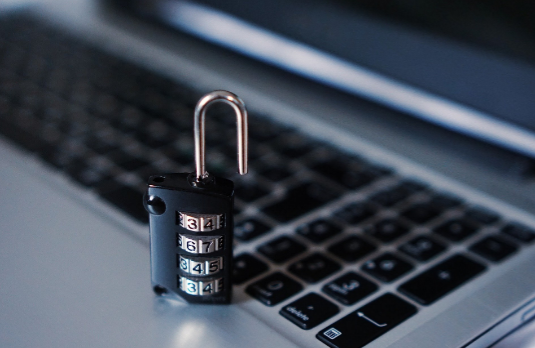 Padlock on keyboard; cybersecurity