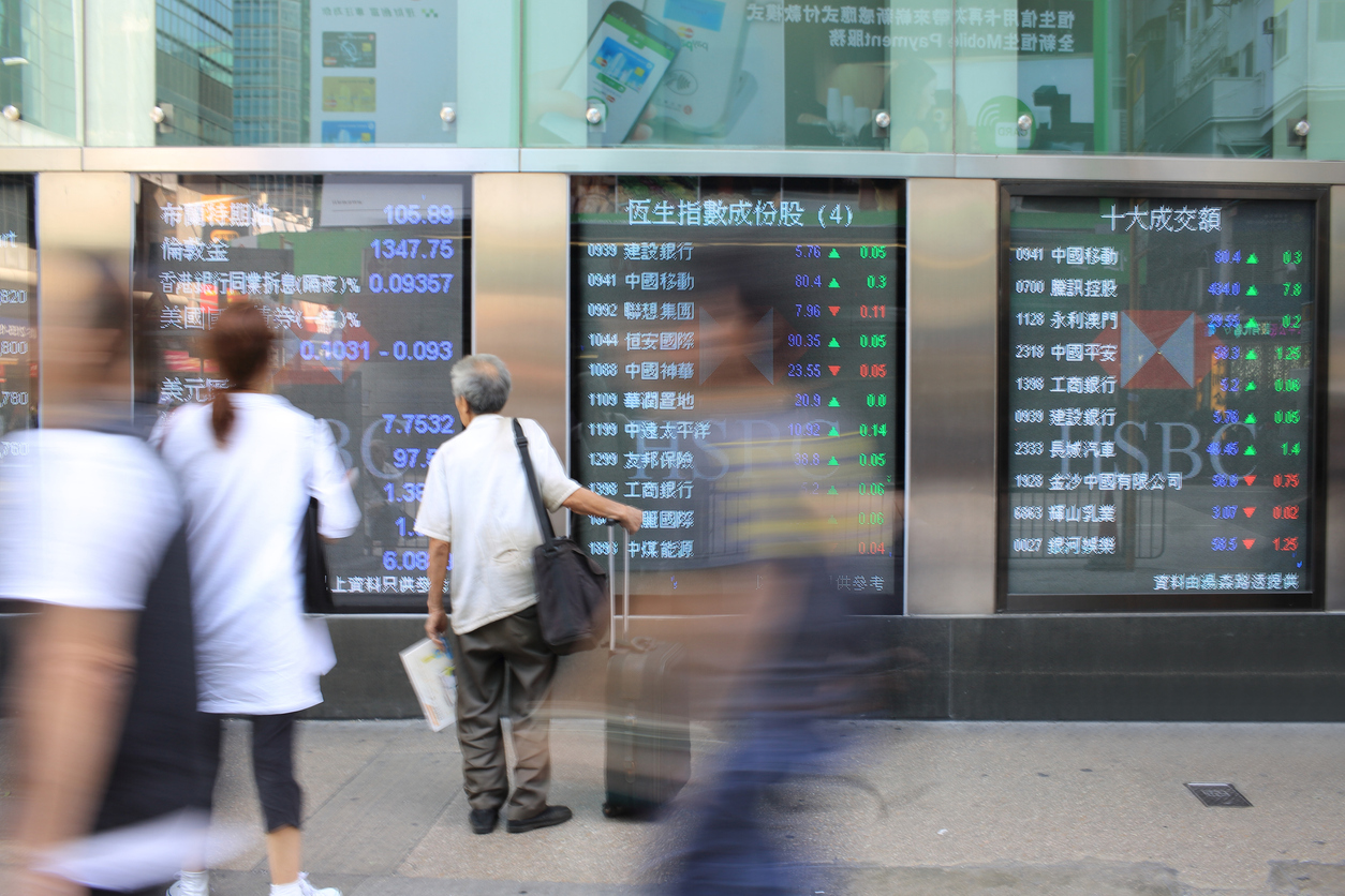 People look at Hang Seng stock index