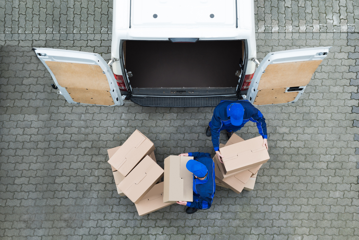 Delivery drivers unloading van