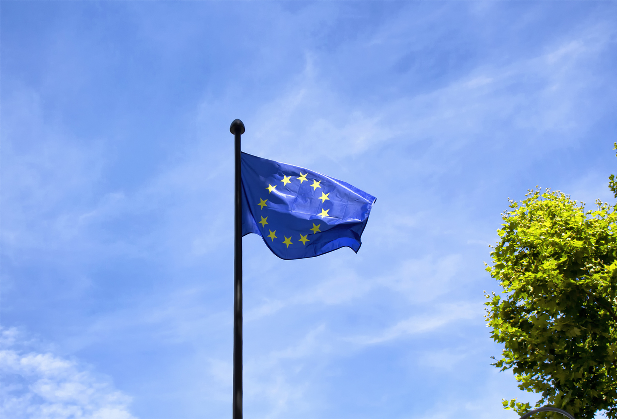 European Union flag with blue sky background in Paris