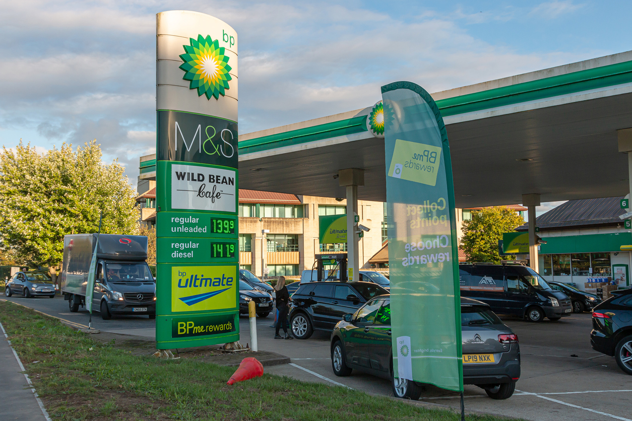 UK supply chain crisis, cars outside petrol station