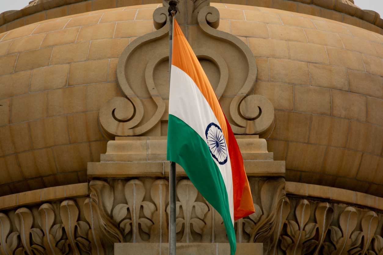 Closeup of Indian Flag waving on the dome of Vidhana Soudha at Bangaluru, India