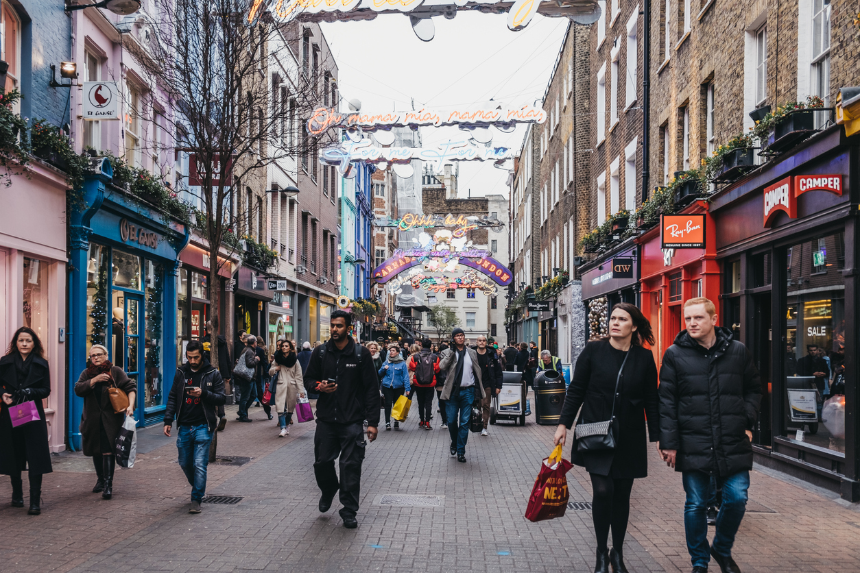 People Christmas shopping in London, UK.