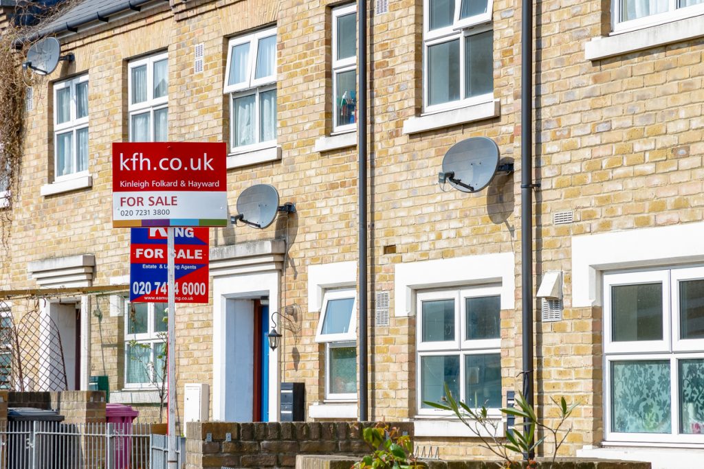 For Sale signs outside a English townhouse