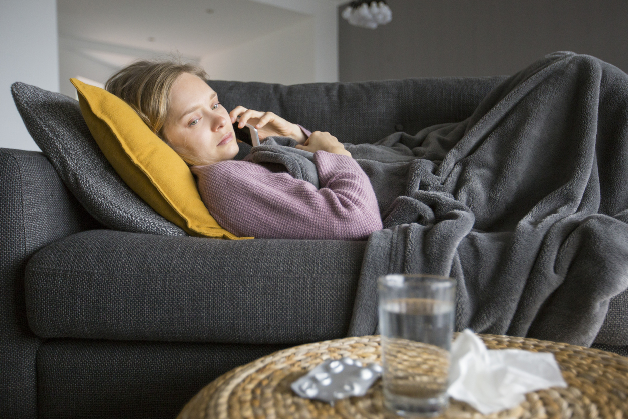 Woman phoning in sick