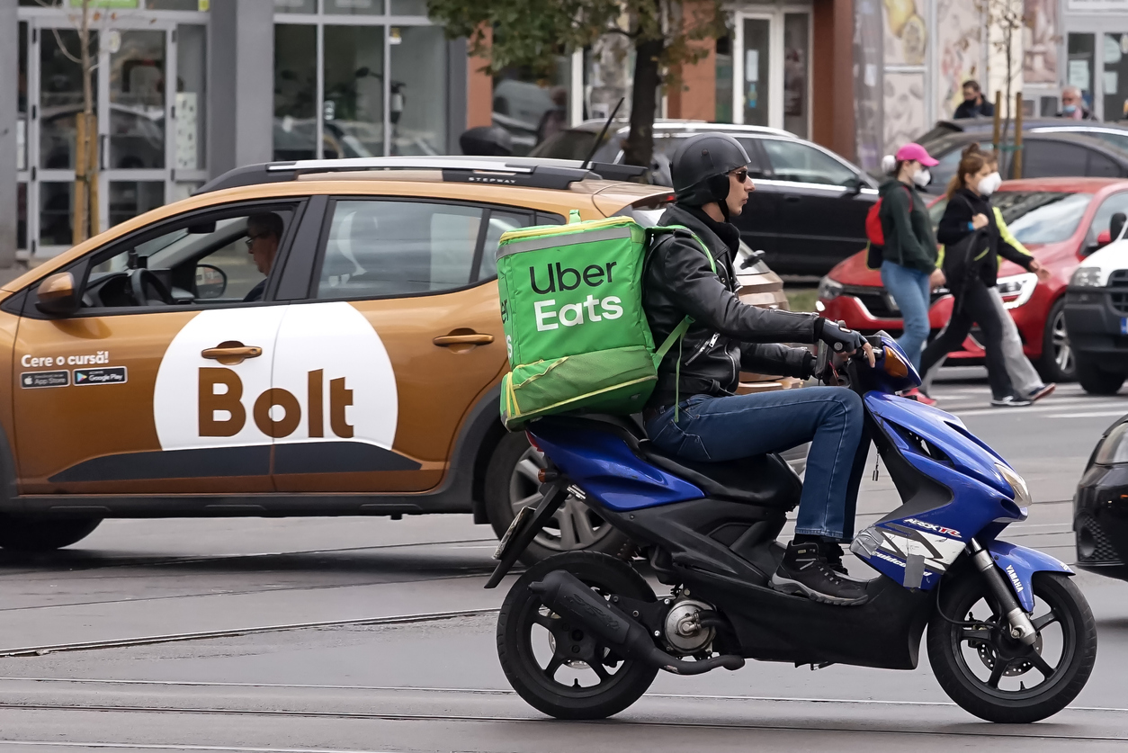 Bolt driver next to Uber Eats driver