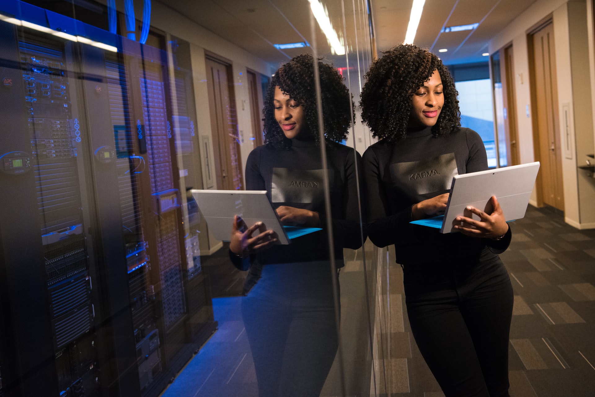 Women working in IT holding laptop