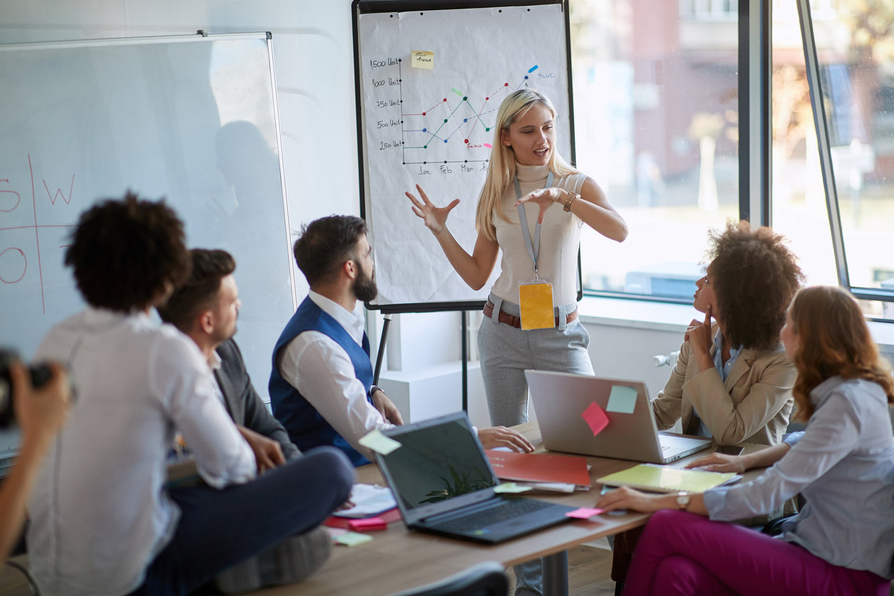 Female business leader giving talk to team