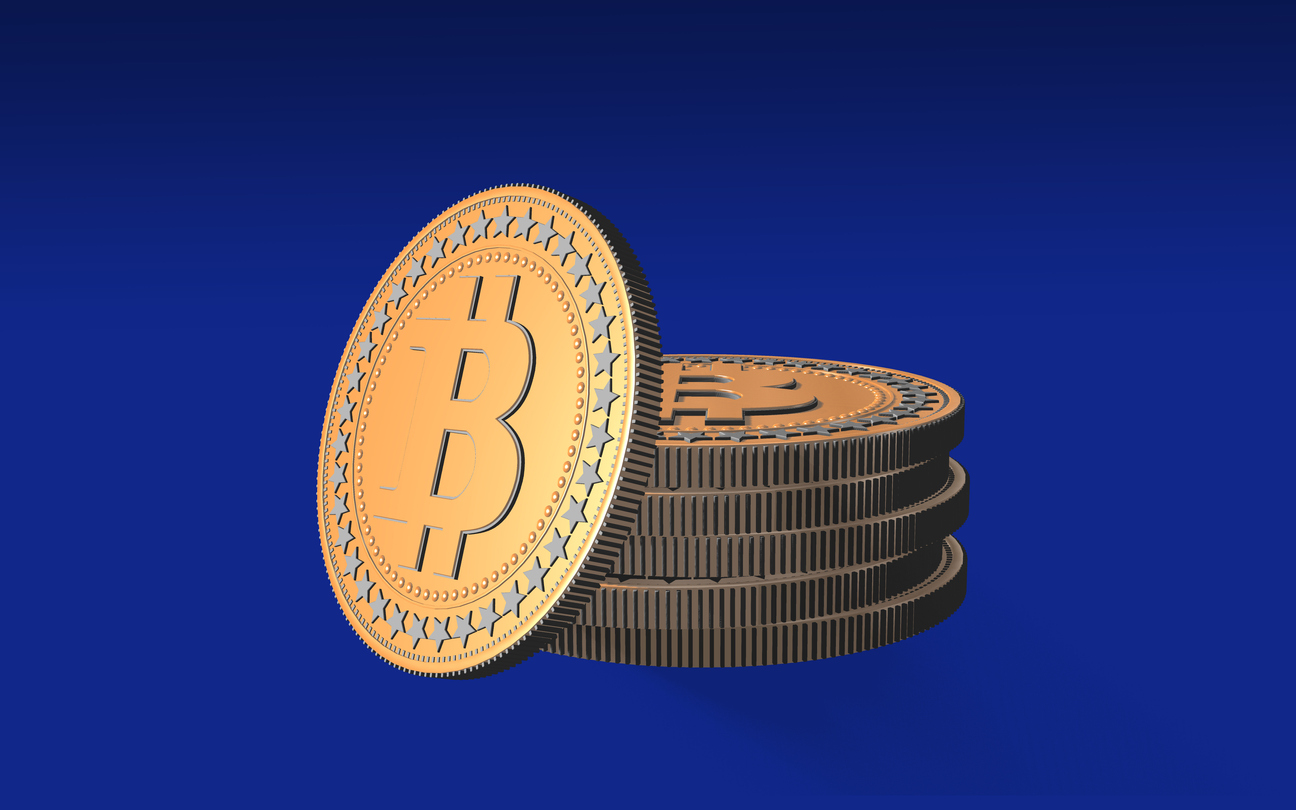 Stack of bitcoins against blue background