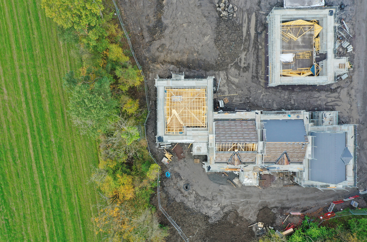 House development construction site in progress aerial view