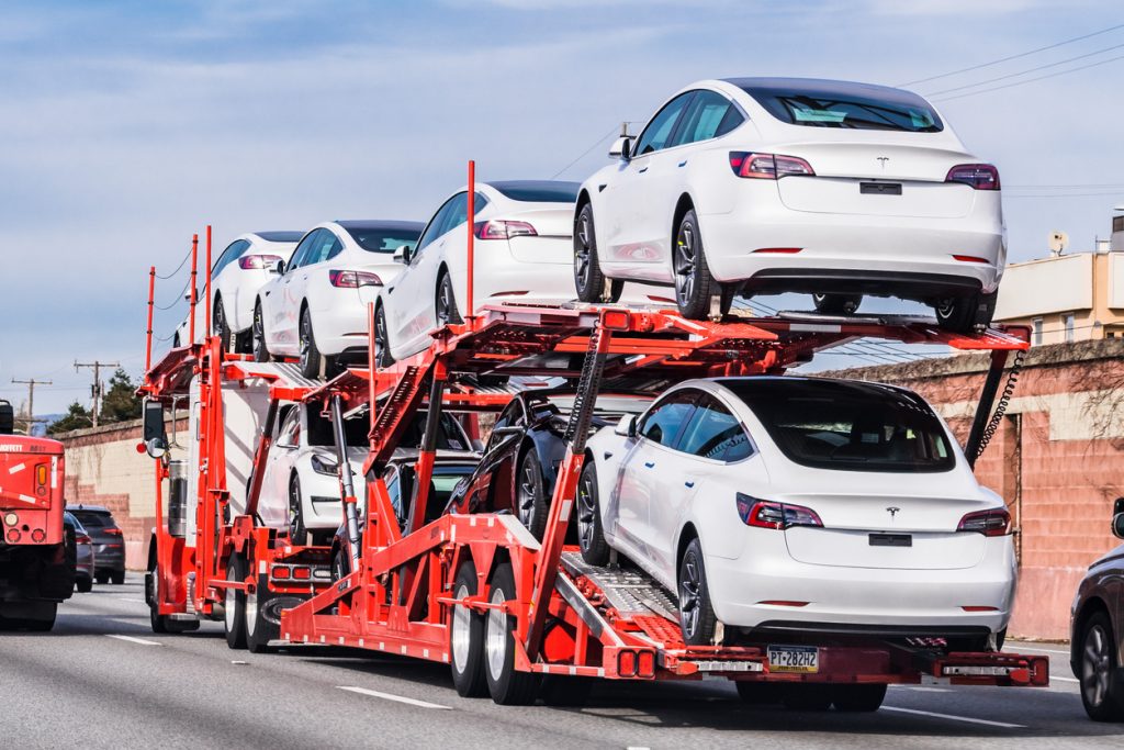 Car transporter carrying Tesla Model 3 vehicles