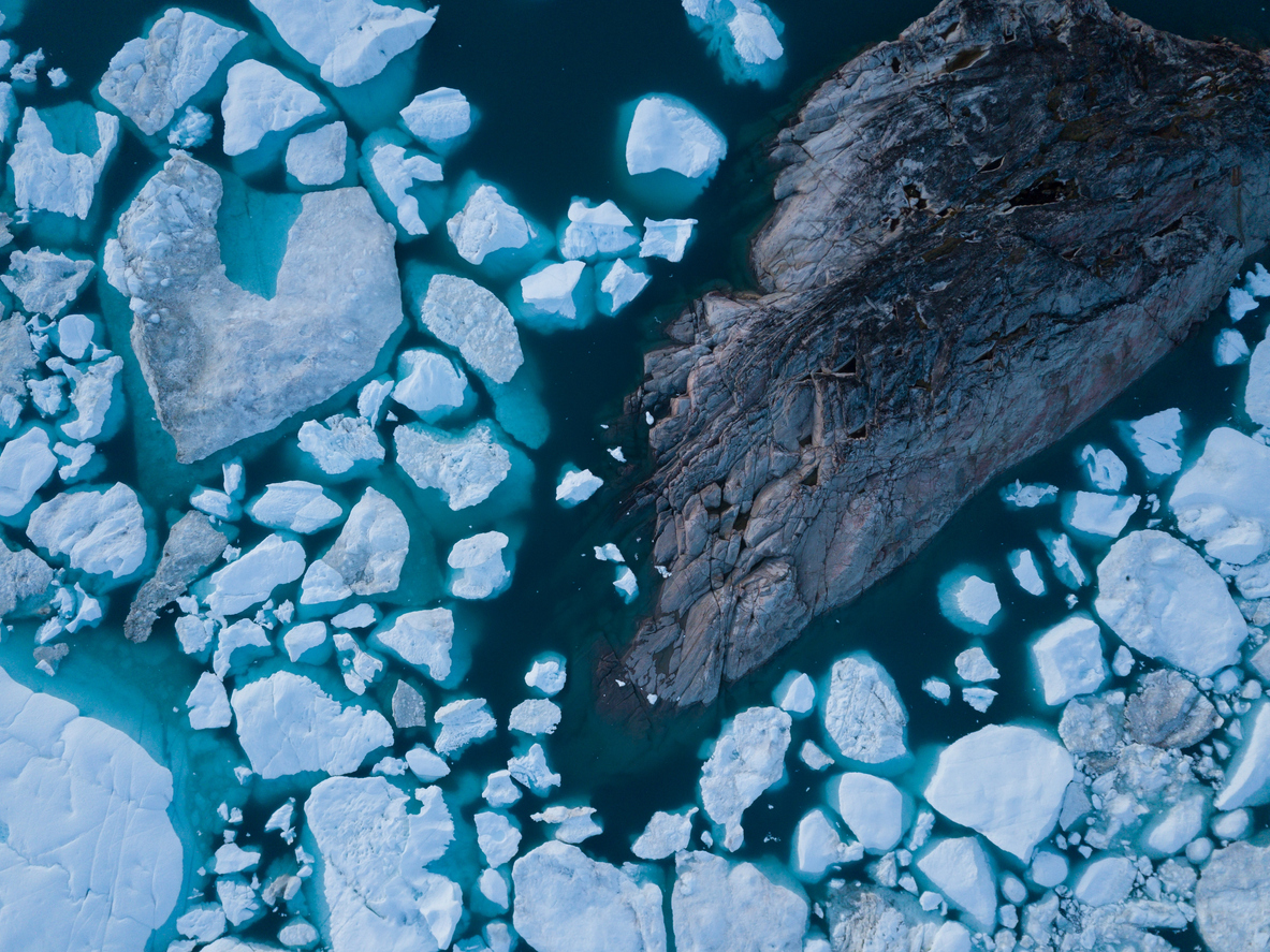 Aerial shot of melting iceberg; climate change