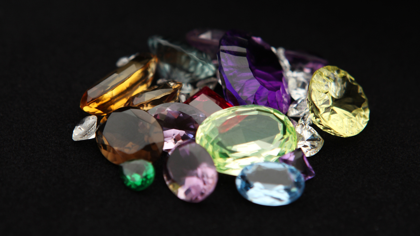 Coloured gemstones on black background