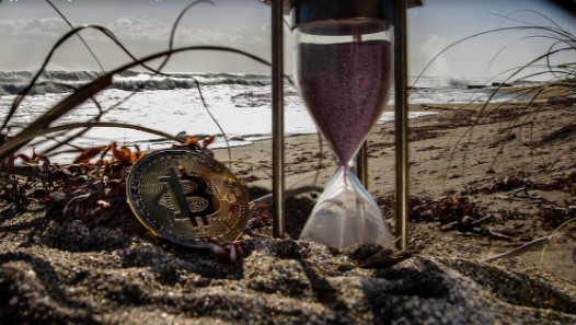 Bitcoin next to hourglass