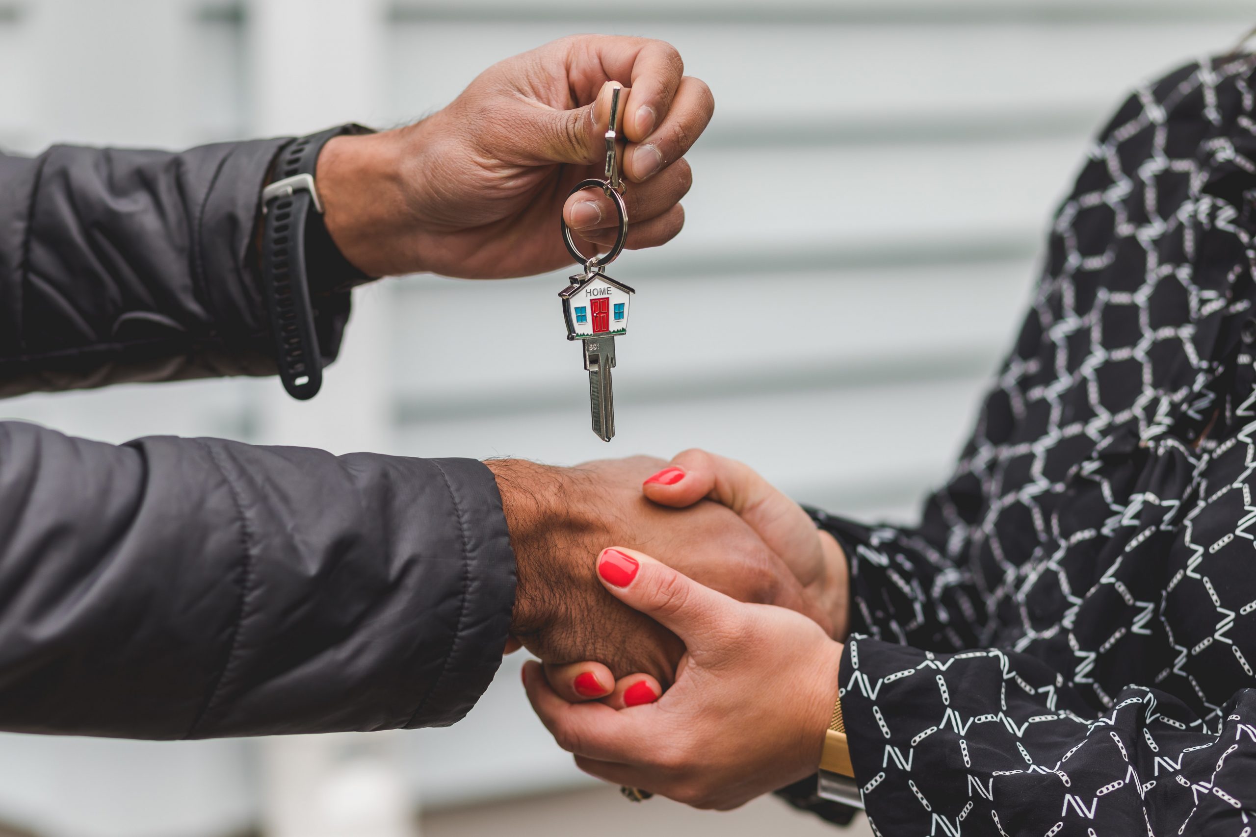 Couple receiving keys to home