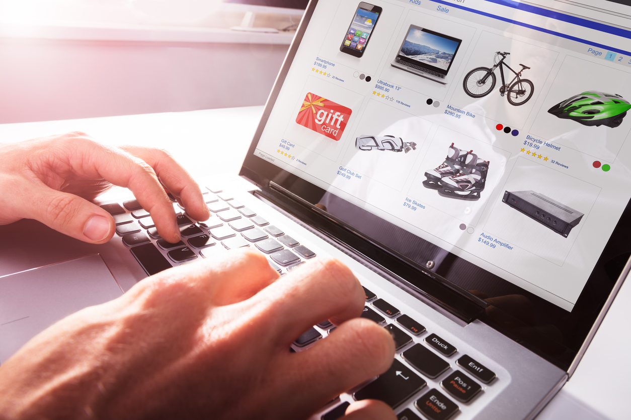 Man accesses eCommerce site via a laptop.