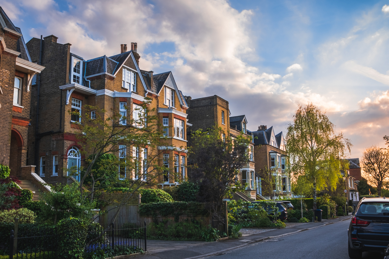 view of traditional residential street in wimbledon, england, at sunset