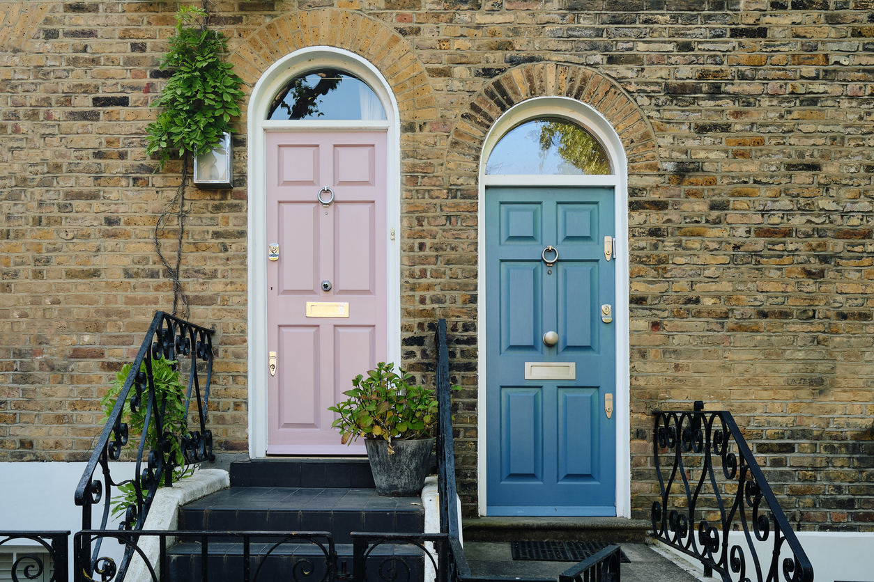 a snapshot of two doors side by side in london.