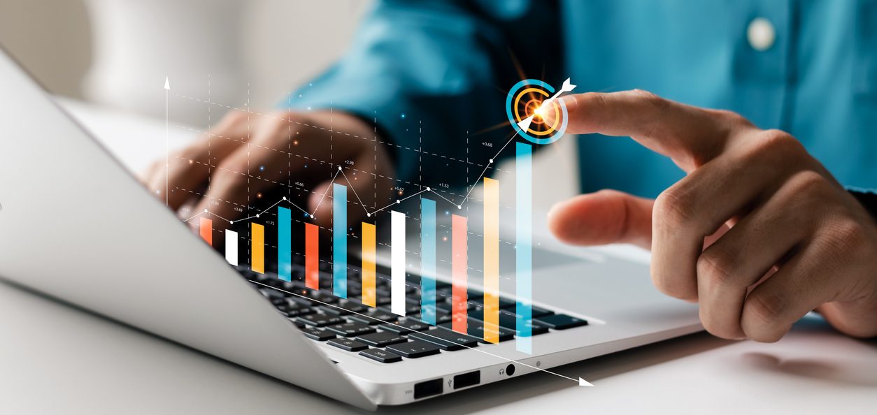 businessman analyzing company's financial balance sheet working with digital augmented reality graphics. businessman calculates financial data for long term investment.