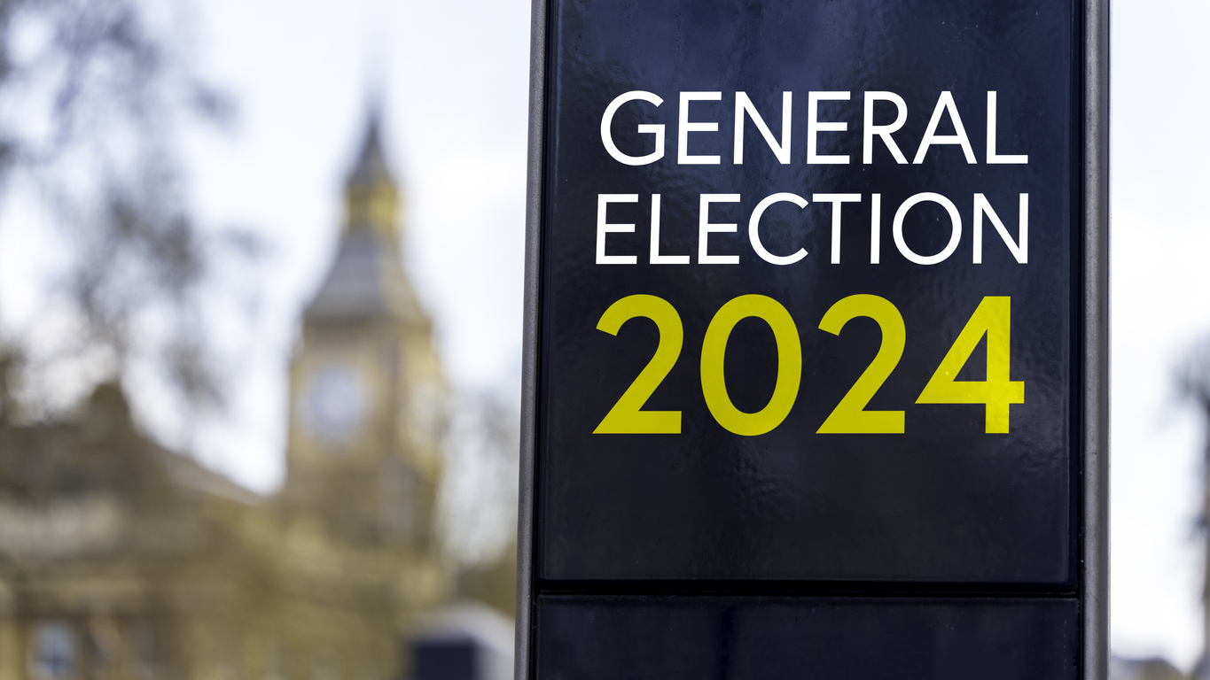 general election 2024 written on a sign with elizabeth tower and big ben in the background