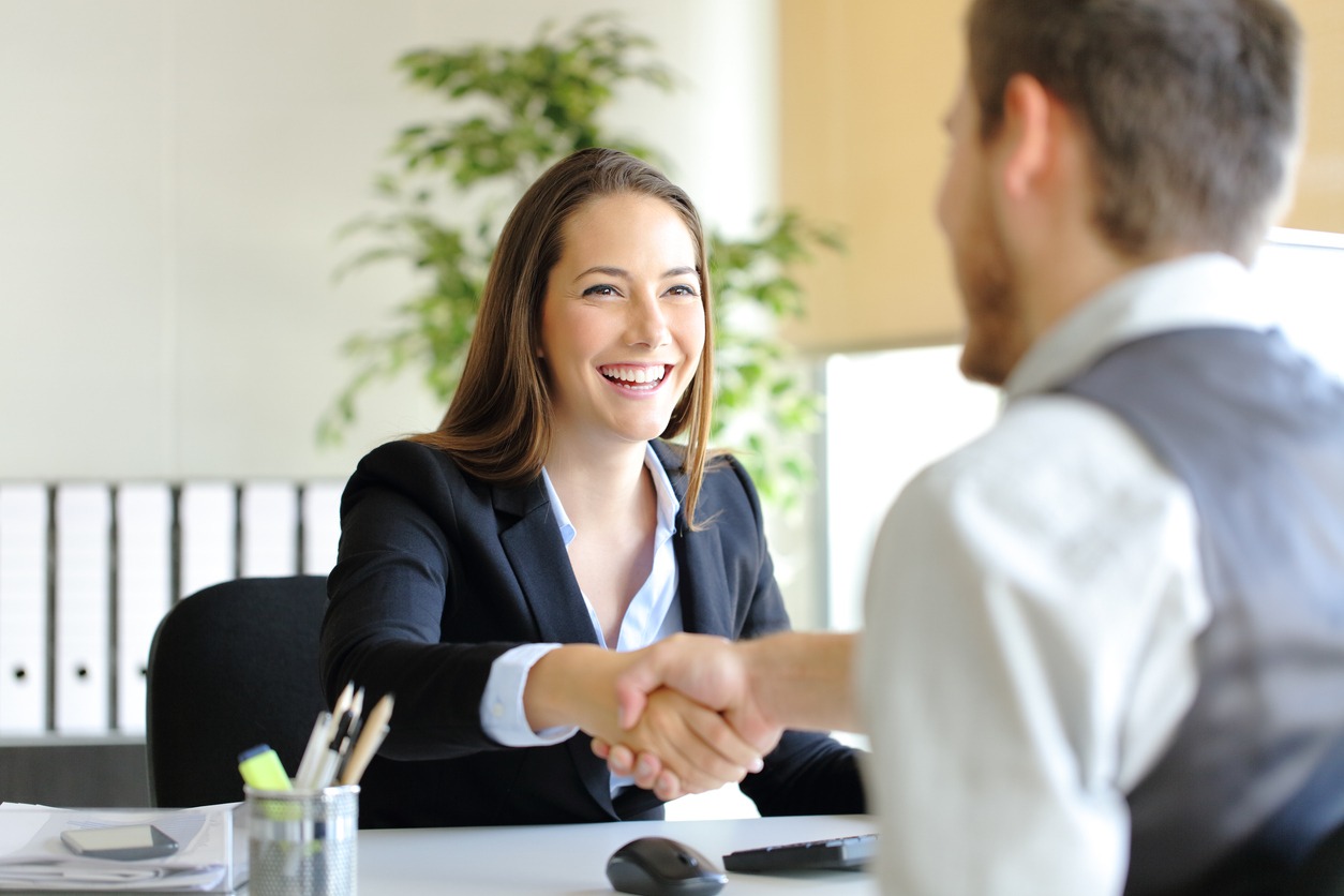 businesspeople handshaking after deal or interview