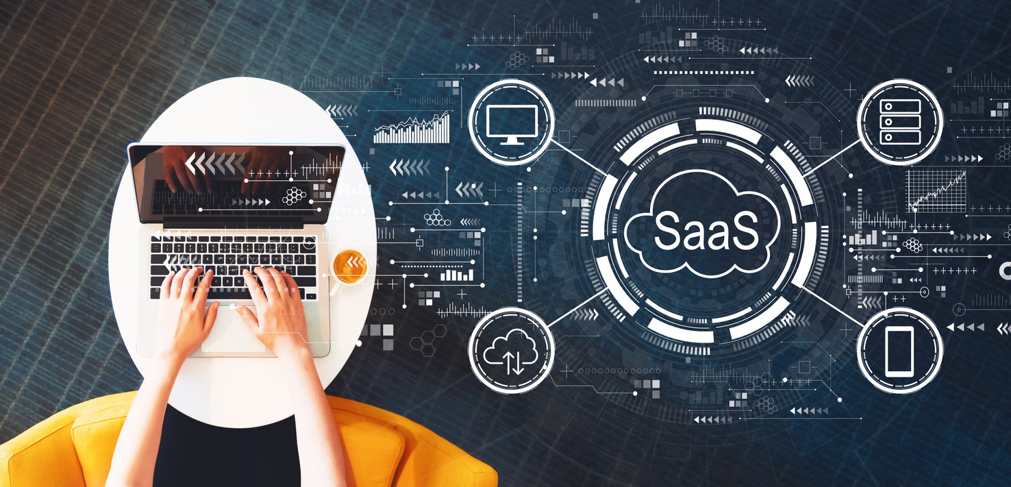 saas software as a service concept with person using a laptop