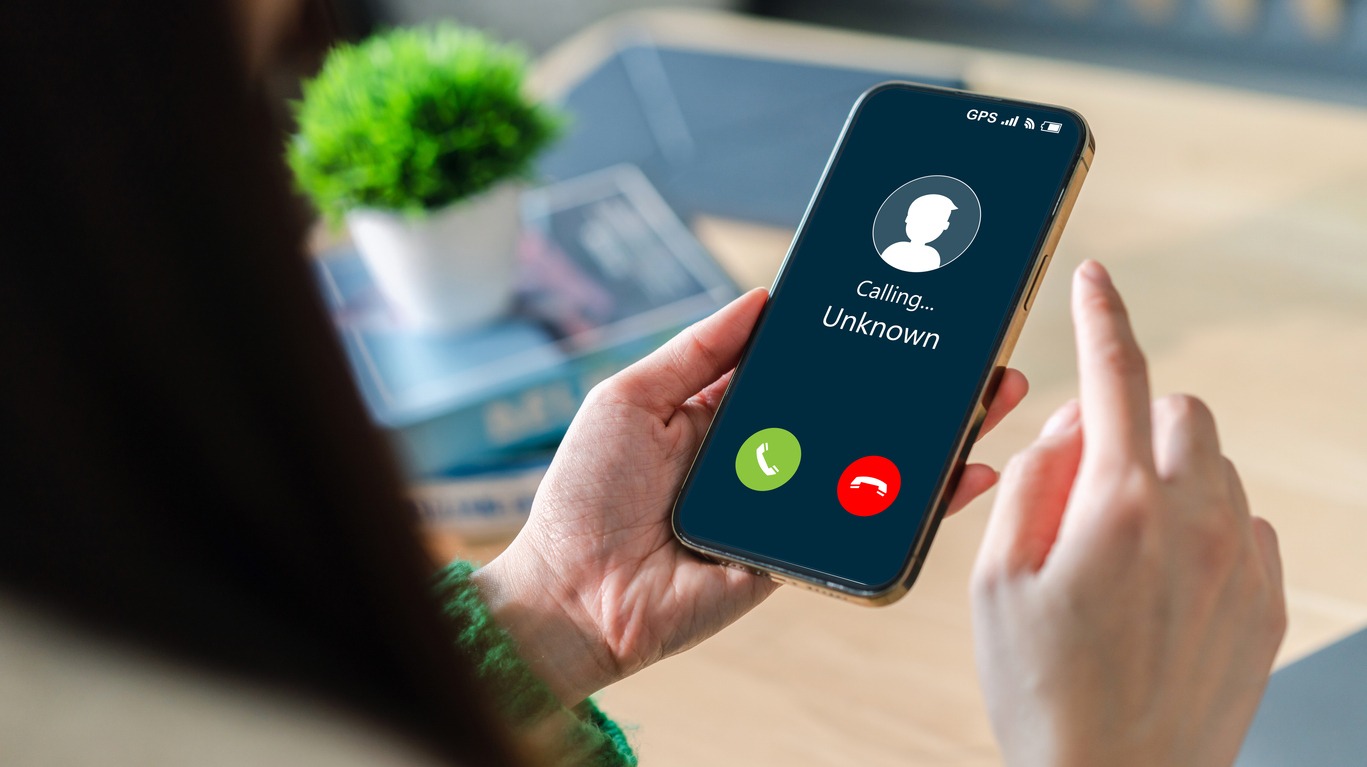 human use smartphone with incoming call from unknown number, spam, prank caller, hoax person, fake identity, scammer, scam with mobile phone, hacker, call center, crime, call, fraud or phishing concept