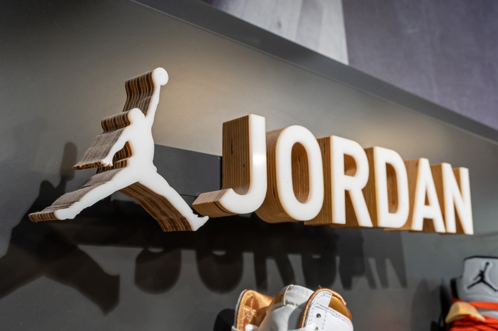 jordan,brand,logo,on,a,stand,with,shoes,in,a