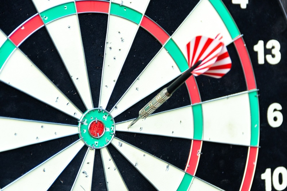 three,darts,hit,the,target,of,a,dart,board.,bad