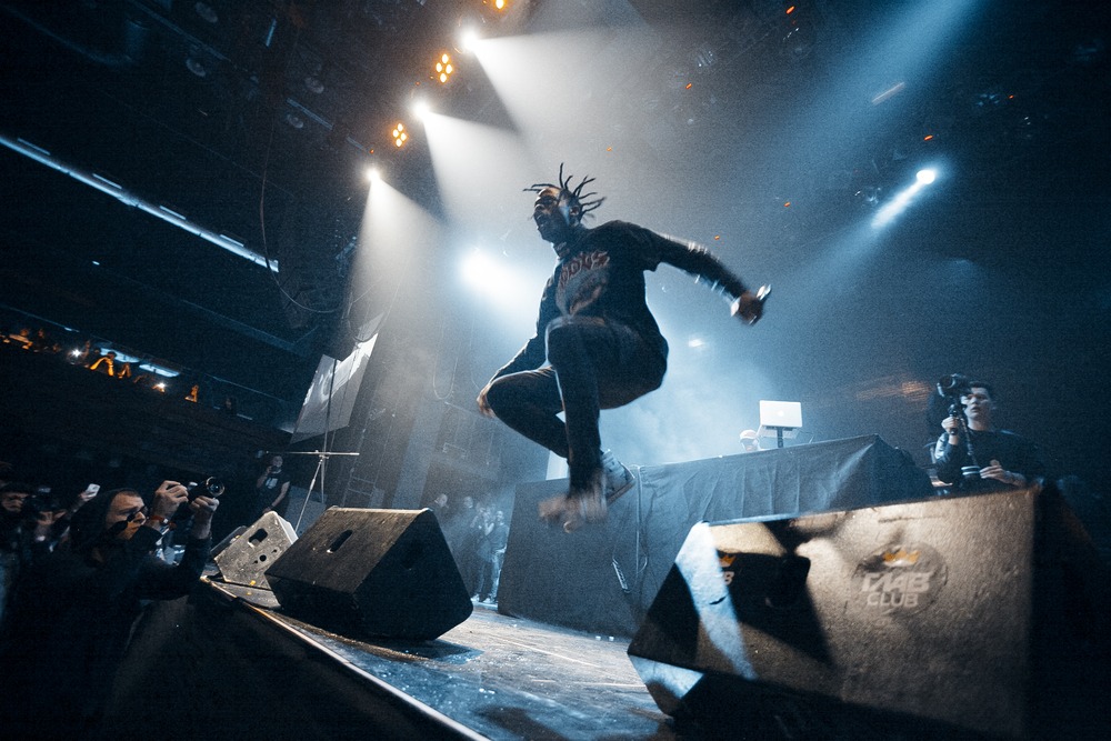 rapper,travis,scott,jumping,on,stage.,famous,american,rap,singer