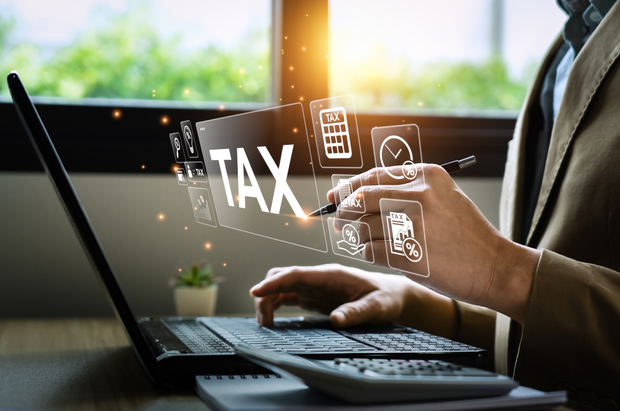 tax deduction planning concept. businessman calculating business balance prepare tax reduction. taxes paid by individuals and corporations such as vat, income tax and property tax.