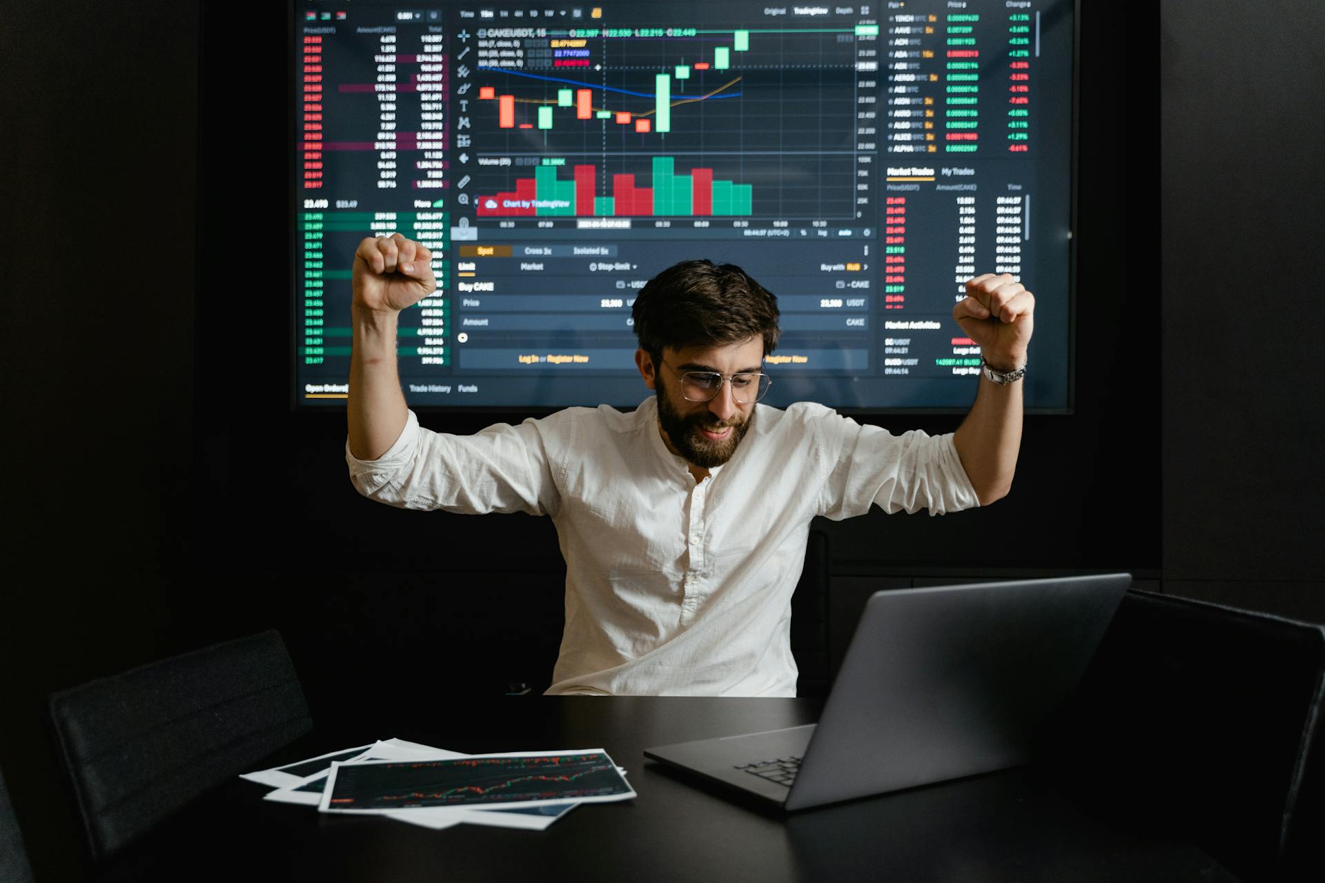 A Businessman Raising His Hands For Being Successful