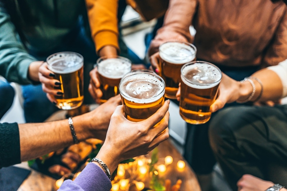 group,of,friends,drinking,and,toasting,glass,of,beer,at