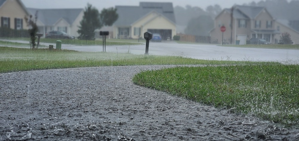 torrential,rains,pour,down,in,a,residential,neighborhood,during,hurricane