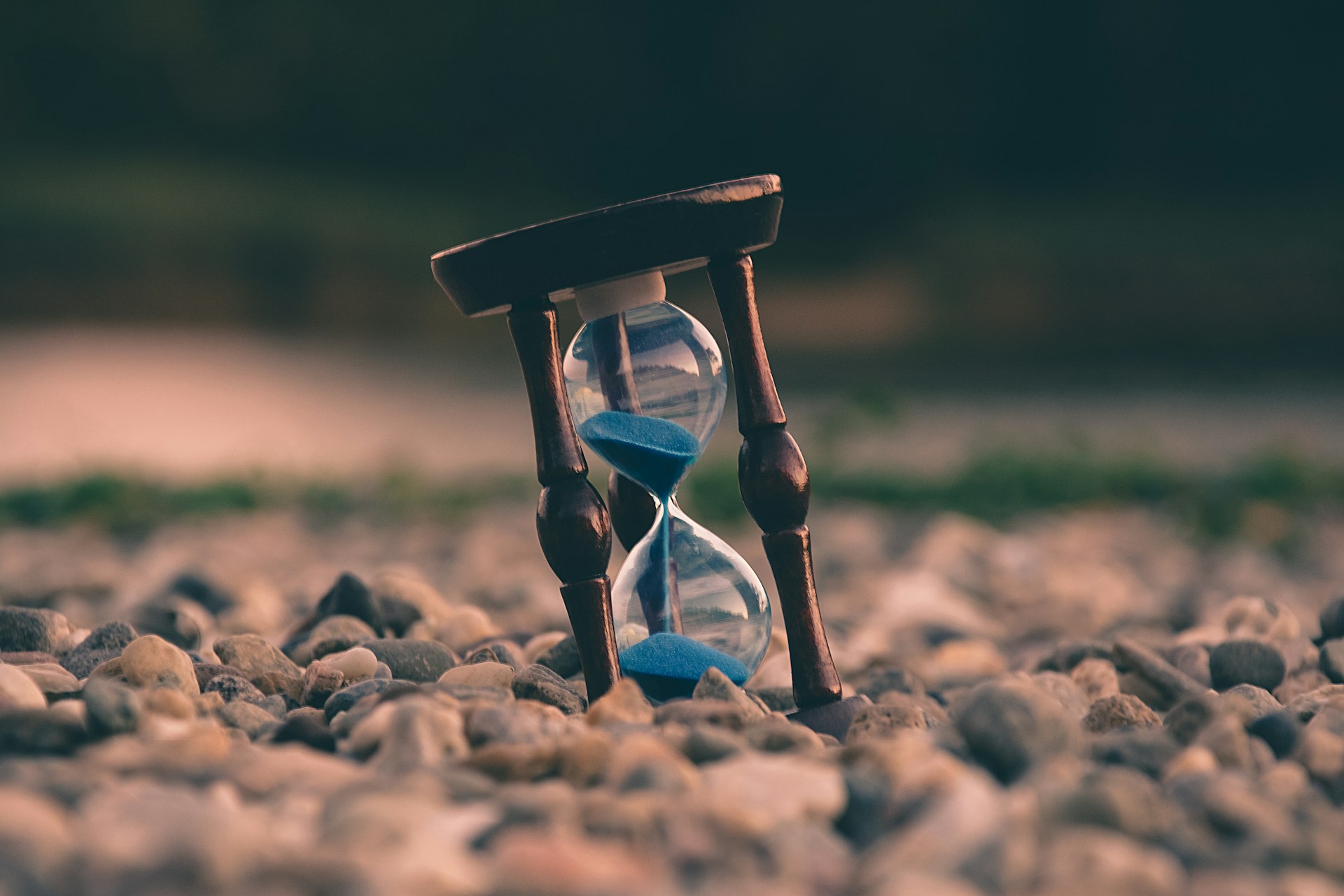 Hourglass placed on top of rocks