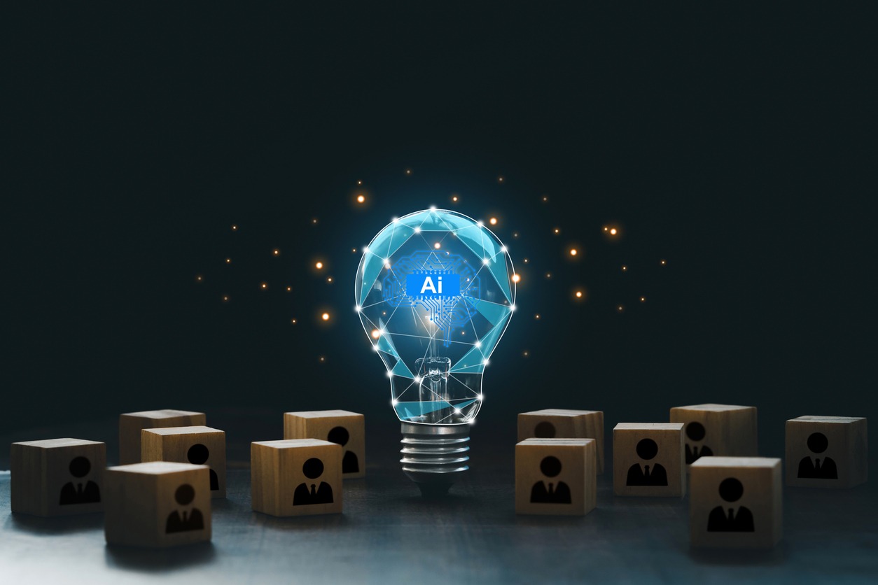 artificial intelligence innovation. ai adoption and working. ai with a digital brain in a lightbulb with human icons in wooden blocks for ai vs human competition. manage personnel in the organization