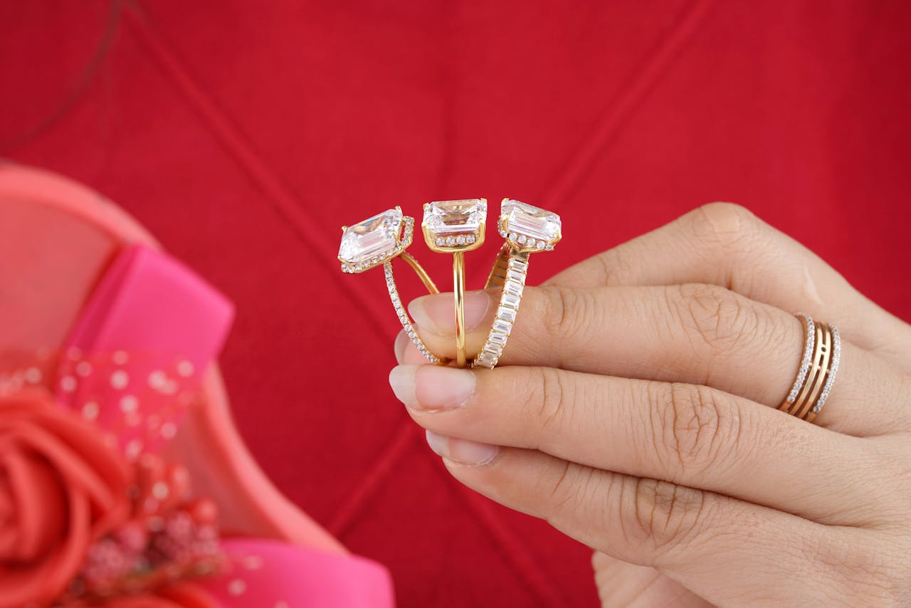 Person Holding Diamond Rings