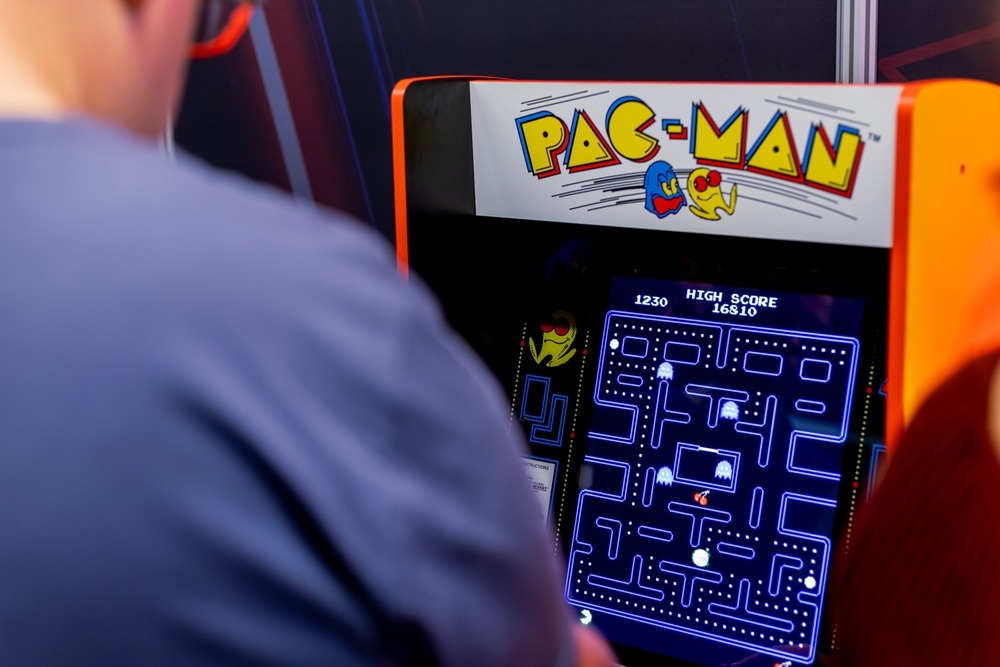 warsaw,,poland, ,may,21,,2023:,man,playing,pac man,arcade